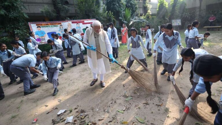 PM Modi participates In cleanliness Drive At Delhi school