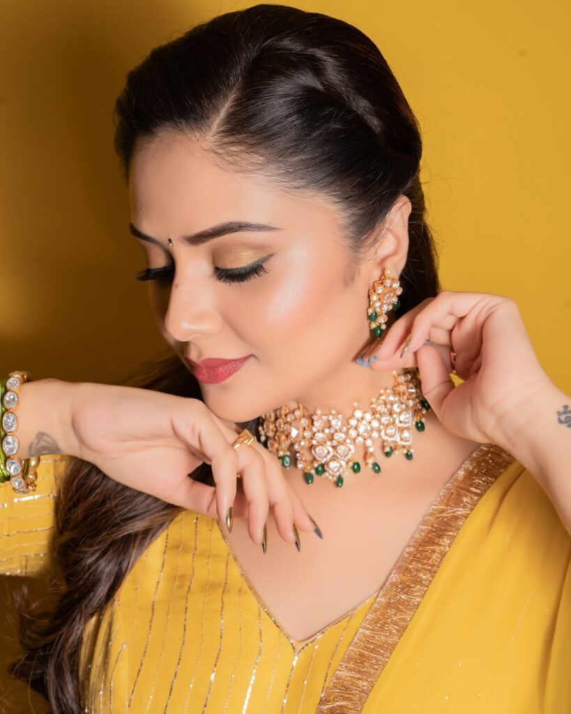 Sreemukhi in a stunning yellow dress